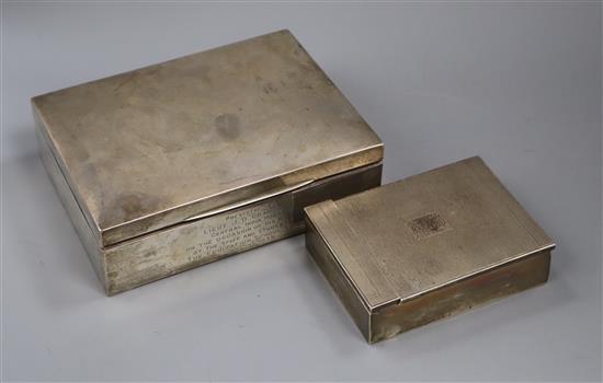 Two 1930s silver cigarette boxes including engine turned, largest 17.8cm.